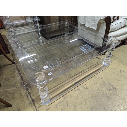 A contemporary square perspex and glass two tier coffee tabl...