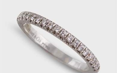 A diamond and platinum band ring, Tiffany & Co....