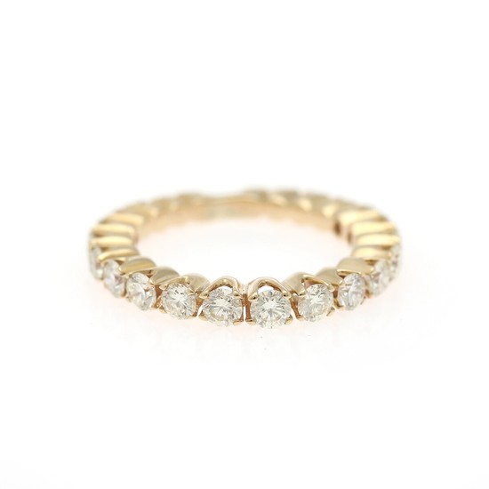 A diamond eternity ring set with numerous brilliant-cut diamonds weighing a total of app. 1.25 ct., mounted in 14k gold. W. 2.7 mm. Size 49.