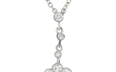 A diamond floral pendant, suspended from an integral chain.
