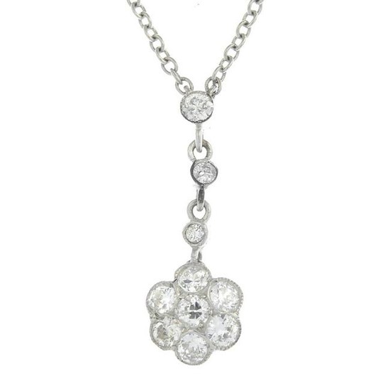 A diamond floral pendant, suspended from an integral