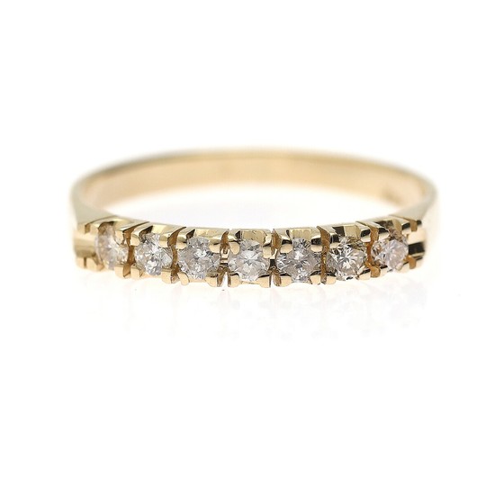 A diamond ring set with seven brilliant-cut diamonds, mounted in 14k gold. Size 54.