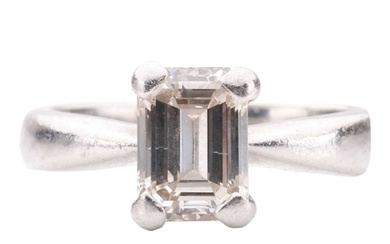 A diamond solitaire ring, set with an emerald-cut diamond wi...