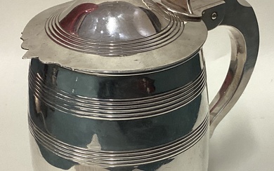 A fine George III silver lidded tankard of barrelled form.