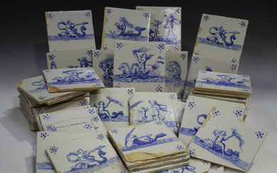 A group of approximately eighty Dutch Delft blue and white tiles, late 19th/early 20th century, each