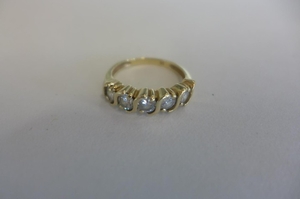 A hand made, yellow gold, five stone diamond ring, diamonds ...