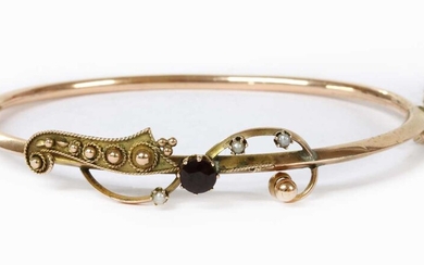 A hollow gold garnet and split pearl bangle