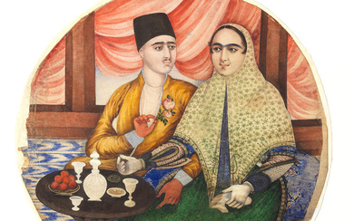 A husband and wife seated on a terrace taking refreshment...