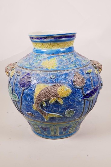 A large Chinese blue ground jar with two mask handles, the b...