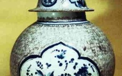 A large baluster shaped jar with manganese powder