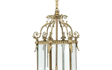 A large bronze and brass hall lantern with bevelled panes. Electrical. 20th century. H. 88 cm. Diam. 40 cm.
