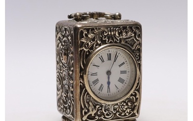 A late Victorian repousse silver cased carriage timepiece, b...