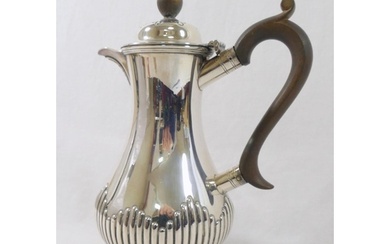 A late Victorian silver hot water jug, Sheffield 1895, of ba...