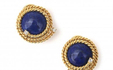 A pair of 18 karat gold lapis lazuli and diamond earrings. Featuring cabochon cut lapis lazuli surrounded by a rope motif border and brilliant cut diamonds, ca. 0.08 ct. French fitting (stud and clip). Gross weight: 15 g.