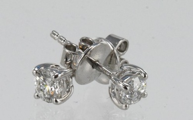 A pair of 18ct white gold certificated diamond solitaire stu...