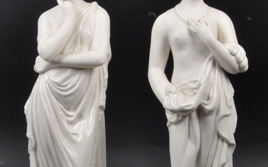 A pair of Belleek figurines entitled ' Meditation and Affection'. Each standing female figure being part glaze and biscuit glazed in flowing classical robes, all raised on armorial shaped plinth bases. Baize lined with gilt impressed marks to bases...