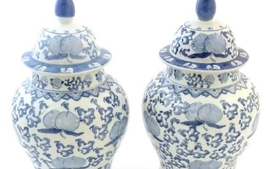 A pair of Chinese lidded vases of baluster form