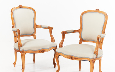 A pair of Rococo style armchairs, cut decor, 20th century.