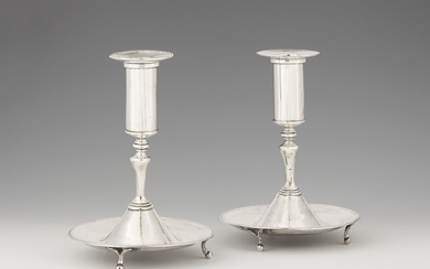 A pair of South American silver candlesticks