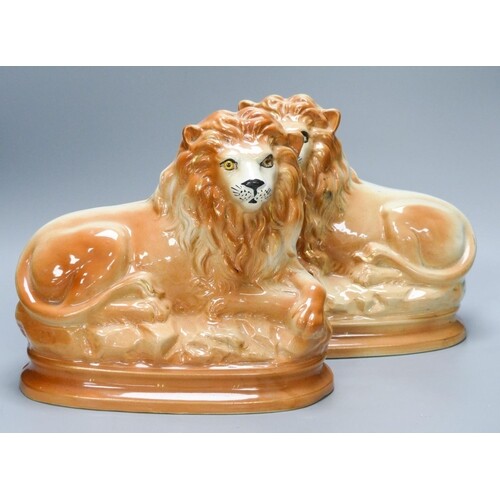 A pair of Staffordshire pottery 'lion' figures 30cm...