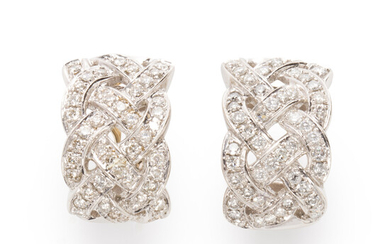 A pair of diamond and fourteen karat white gold earclips