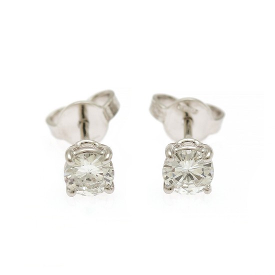 A pair of diamond ear studs each set with a brilliant-cut diamond, totalling app. 0.67 ct., mounted in 18k white gold. Top Wesselton/SI. (2)