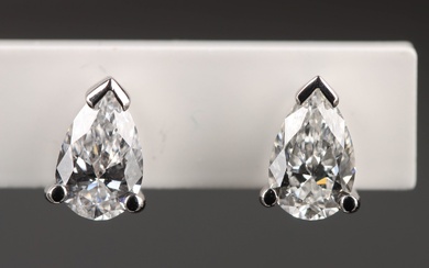 A pair of drop cut diamond studs, total 0.82 ct. of 18 kt. white gold (2)