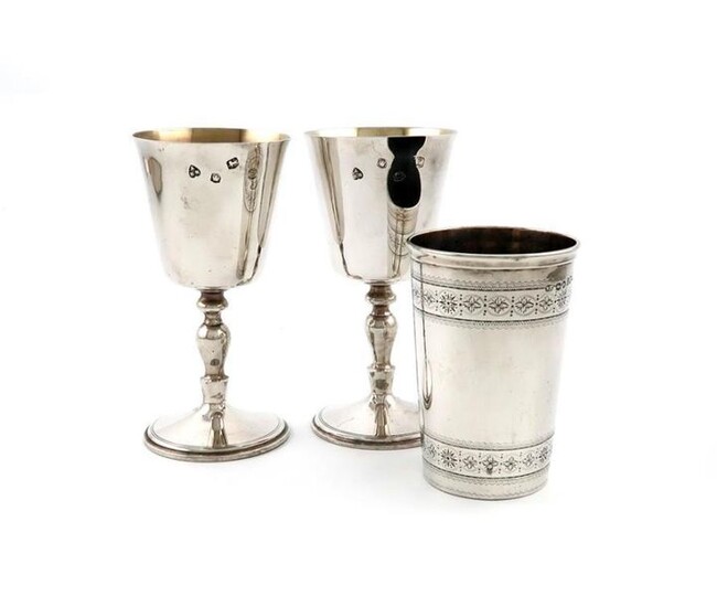 A pair of modern silver goblets, by A Haviland-Nye, Sheffield 1967, tapering circular bowls, on knopped stems on raised circular bases, height 14.5cm, plus a Victorian silver beaker, by William Evans, London 1875, height 10.5cm, approx. weight 16.8oz...