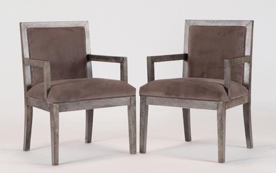 A pair of open arm chairs covered in shark skin colored parchment. Ht: 33" Wd: 24" Dpth: 21.5" Seat