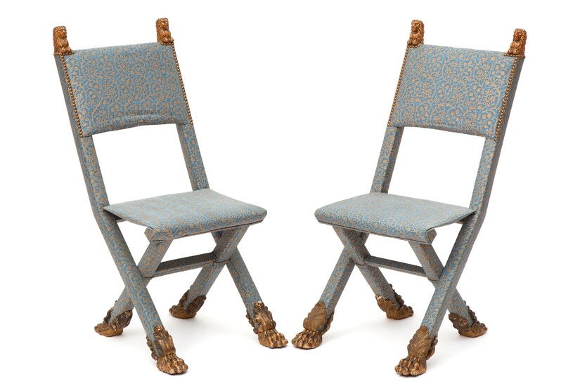 A pair of upholstered folding chairs