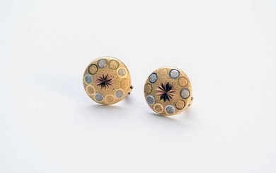 A pair of yellow and white metal earrings