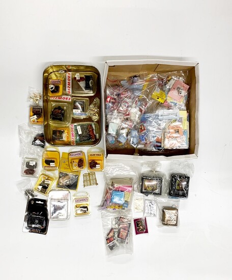 A quantity of boxed wired dolls house fire places including some fire place ornaments, together with a box of dolls house gift bags, party i