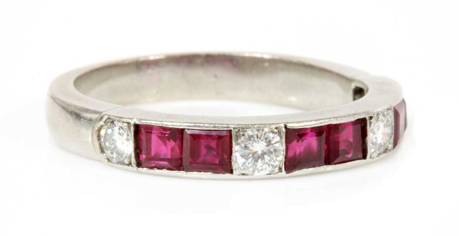 A ruby and diamond half eternity ring