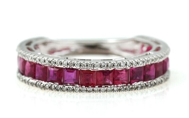 A ruby and diamond ring set wtih numerous square-cut rubies weighing a...