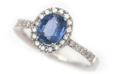SOLD. A sapphire and diamond ring set with an oval-cut sapphire encirclec by numerous brilliant-cut diamonds, mounted in 18k white gold. Size 54d – Bruun Rasmussen Auctioneers of Fine Art