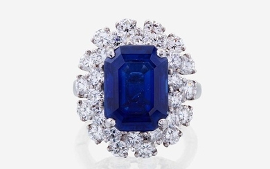 A sapphire, diamond, and fourteen karat white gold ring