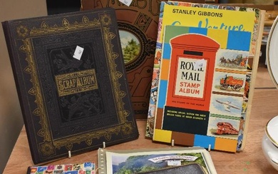 A small collection of stamp albums containing commemorative stamps, for Queen Elizabeth II, world