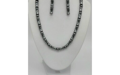 A spectacular, carved hematite, necklace, bracelet and earri...