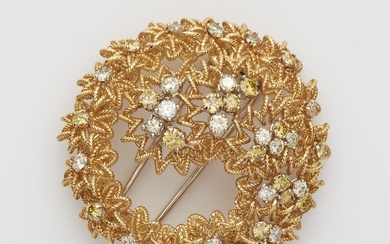 A structured 18 kt gold wire brooch set with white and lemon coloured diamonds.