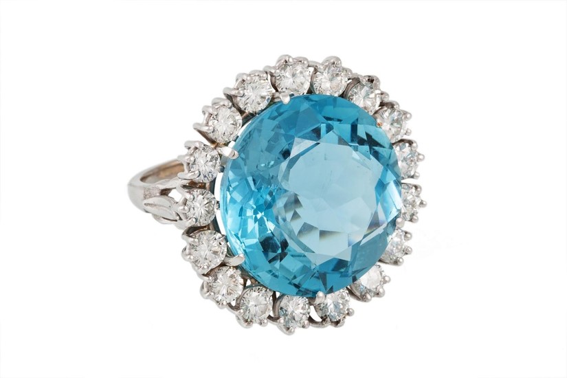 AN AQUAMARINE AND DIAMOND CLUSTER RING, the large circular a...