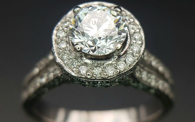 An 18 K white gold ring with a brilliant...