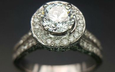 An 18 K white gold ring with a...