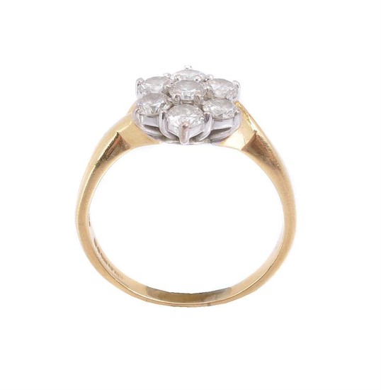 An 18 carat gold diamond cluster ring