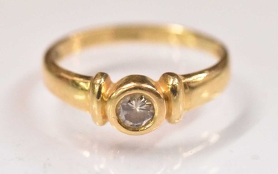 An 18ct yellow gold diamond solitaire ring, the central stone...