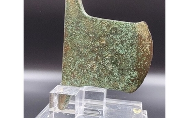 An Ancient Luristan Bronze Axe Head Mounted On Acrylic