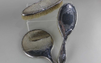 An Edward VII silver three piece dressing table set