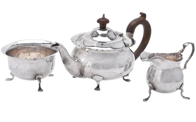 An Edwardian silver circular three piece tea set by George Nathan & Ridley Hayes