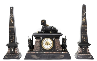 An Egyptian Revival marble and slate mantel clock garniture