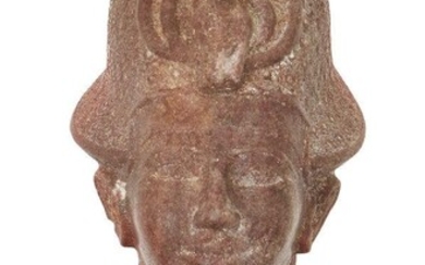 An Egyptian style quartzite head of a Ramesside style quartzite head of a king, wearing the Blue Crown (khepresh) with frontal uraeus, the dorsal column, Not Ancient, 16.2cm high Provenance: Formerly in the private collection of Werner Forman...
