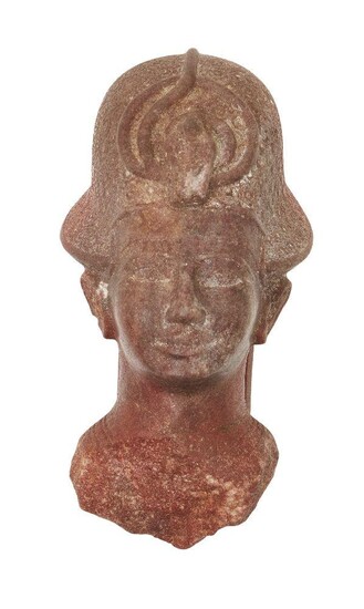 An Egyptian style quartzite head of a Ramesside style quartzite head of a king, wearing the Blue Crown (khepresh) with frontal uraeus, the dorsal column, Not Ancient, 16.2cm high Provenance: Formerly in the private collection of Werner Forman...